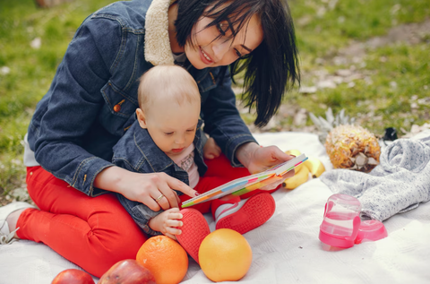 A Mom Reading Books With Baby