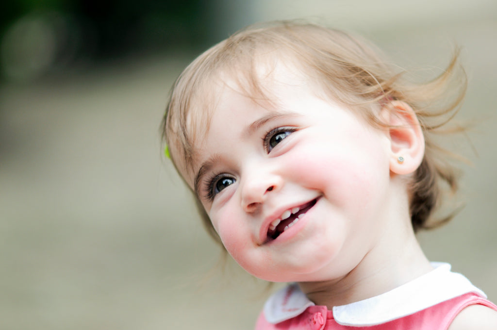 A adorable little girl playing urban park