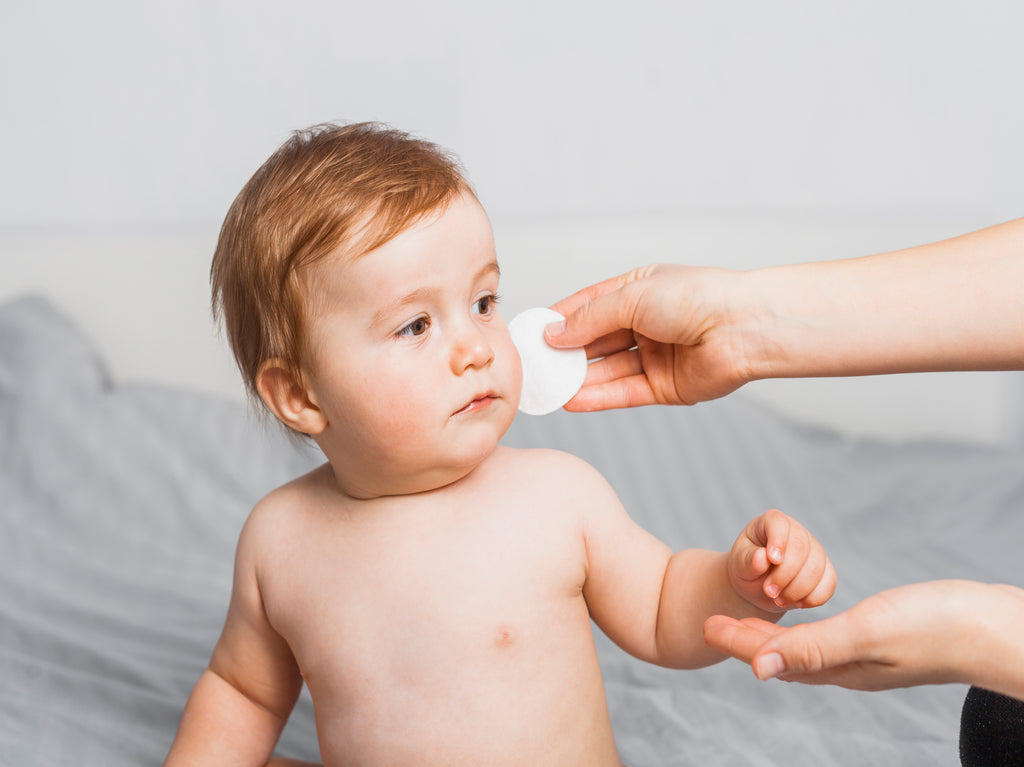 A baby cleaned with cotton