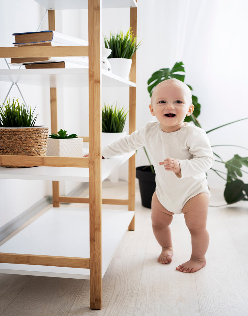 A cute baby going their first steps