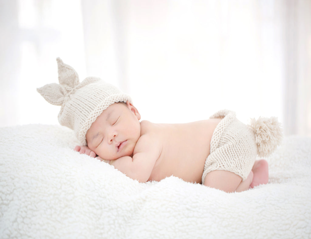 Lovely newborn sleeping furry cloth