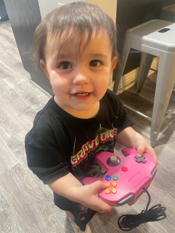 Child with Nintendo 64 N64 Controller