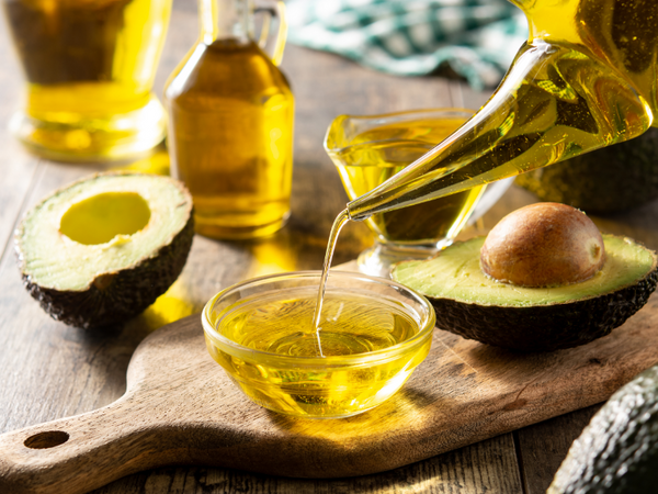 Picture of avocado oil being poured into a bowl