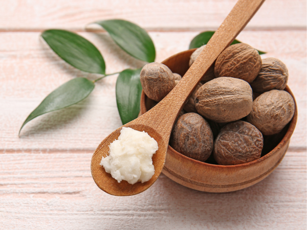 Picture of shea butter displayed on a wooden spoon