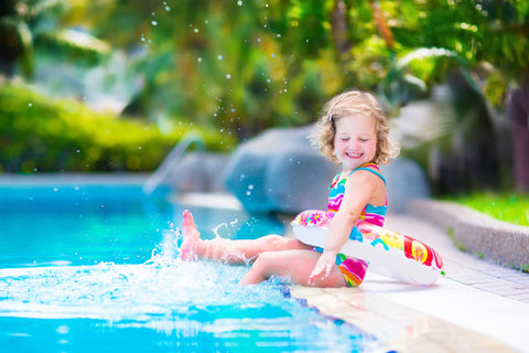 kid playing by the pool