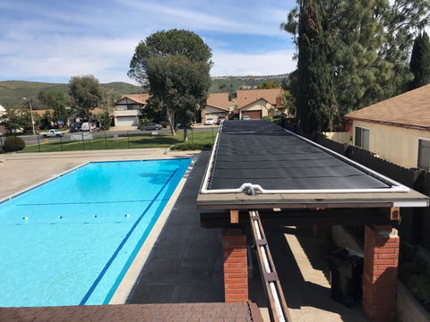 in ground swimming pool with solar pool heating panels