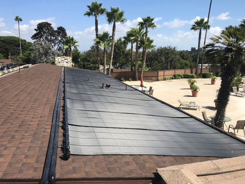 solar pool heater panels and palm trees