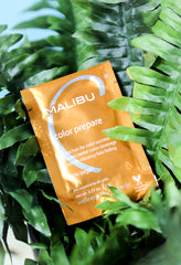 Malibu C Color Prepare packet on palm fronds