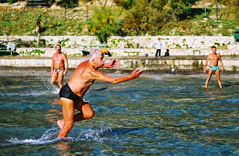 Older man playing Picigin in Croatia