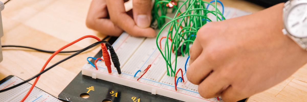 STEM student with robotics kit