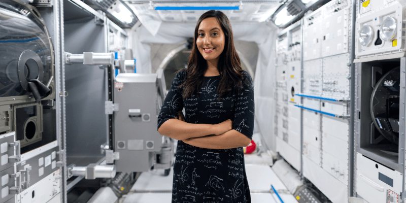 Female space operations engineer in space tunnel