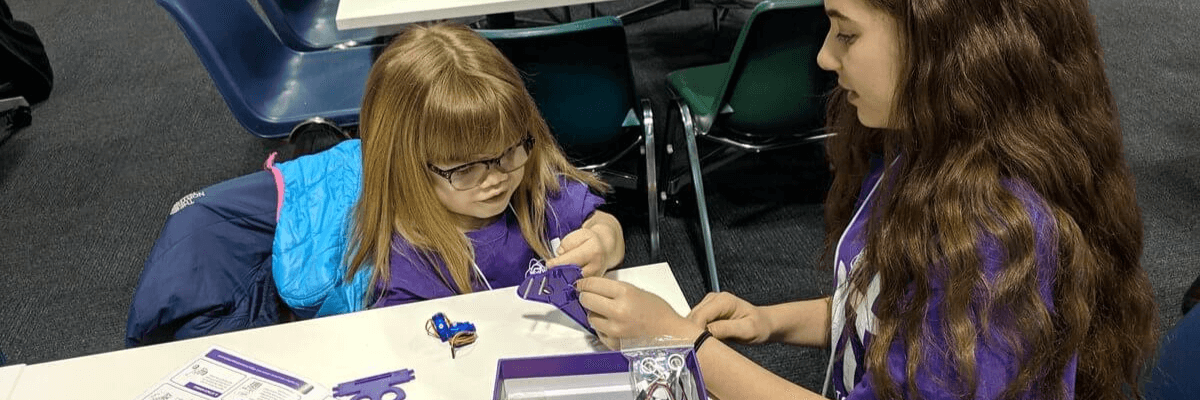 Female STEM students assembling k8 robotics kit