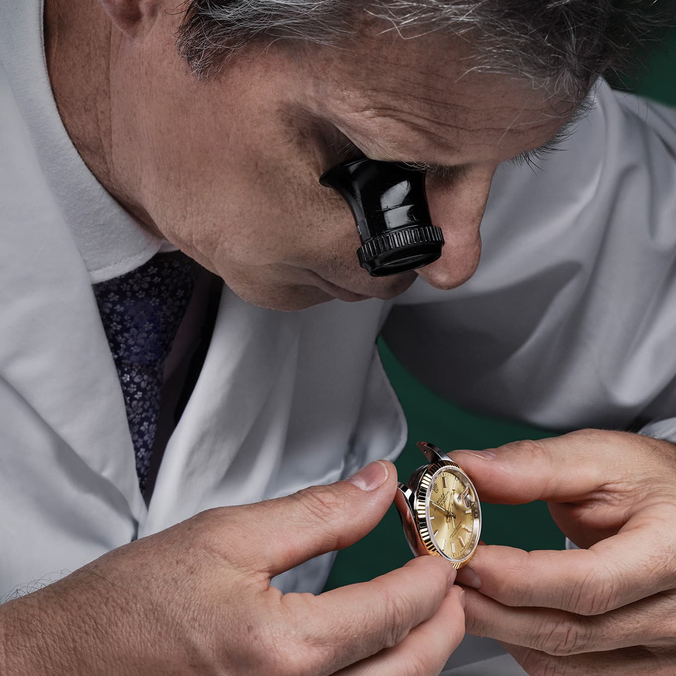 Rolex watch being assessed by a watchmaker