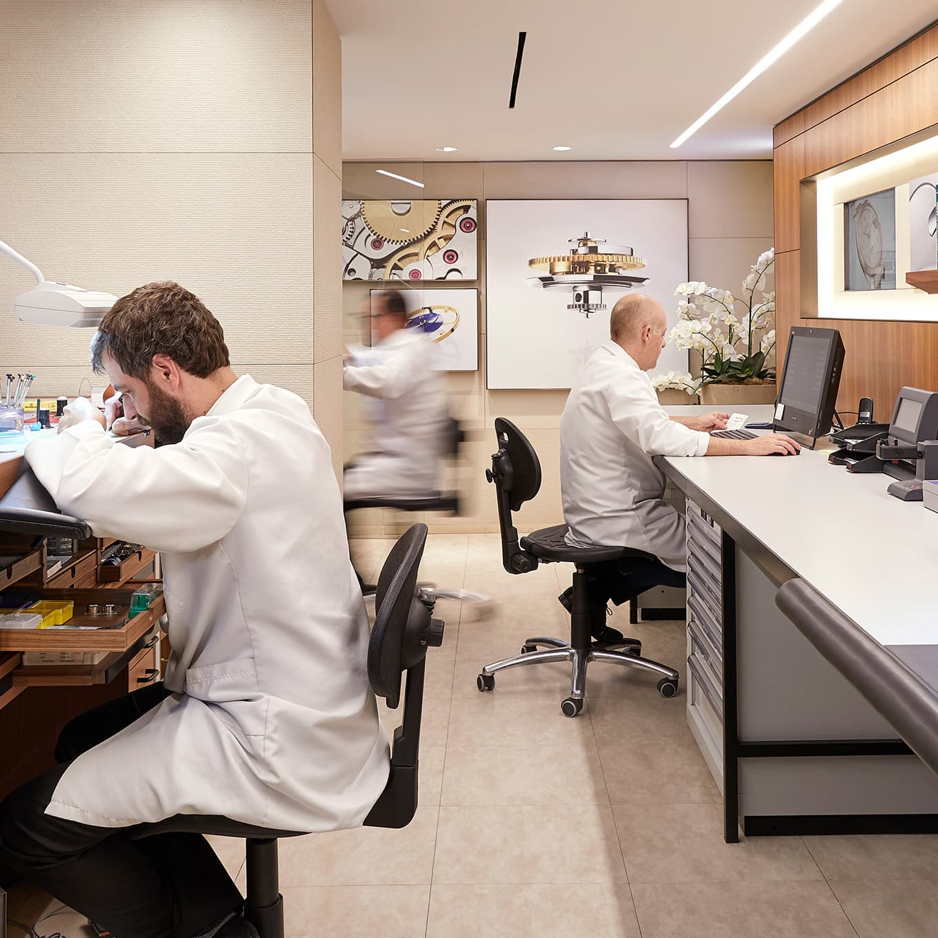 Rolex watchmakers working in our cutting-edge workshops