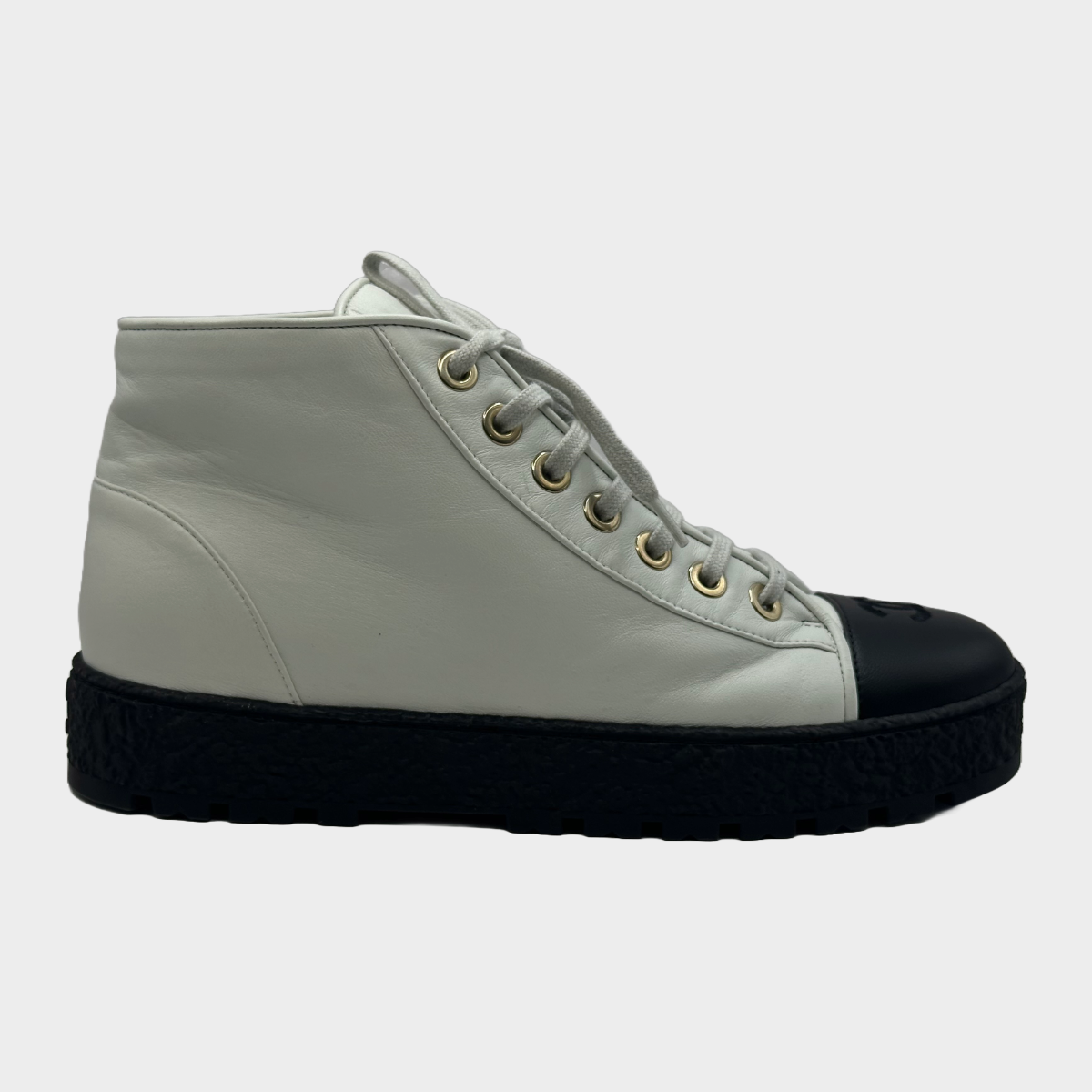 image of Chanel women's white and black leather platform sneakers