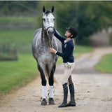 The Equestrianista Perfect Fit Logo Sweater paired with her gorgeous Dapple Grey gelding.