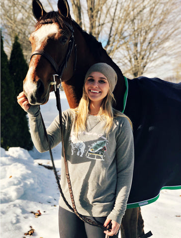 Equestrian Lifestyle Blogger the East Coast Equestrian modeling the Equestrianista One Horse Open Sleigh Holiday Sweater.