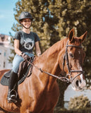 Equestrian Trend dressage schooling in her Equestrianista Glitter Logo T-shirt.