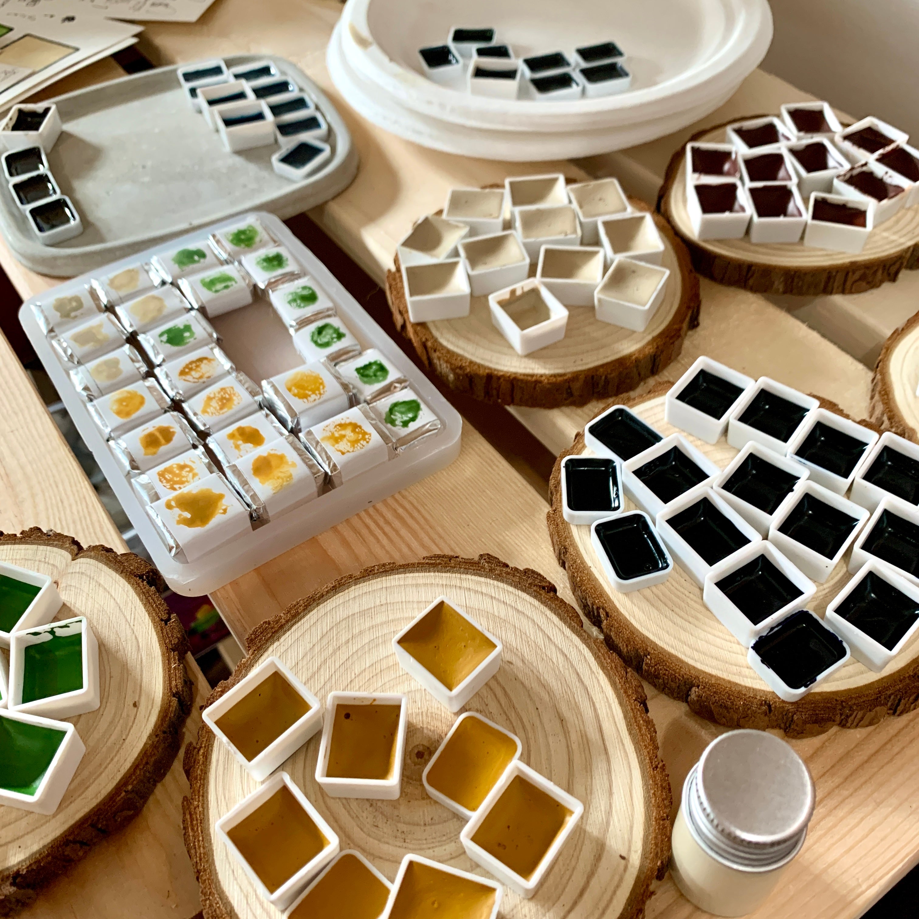 Close up of handmade watercolour paints in individual paint pans