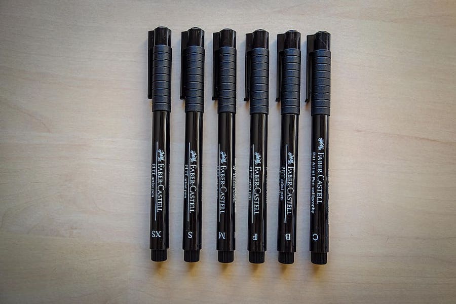 Lineup of 6 black drawing pens from FAber Castell