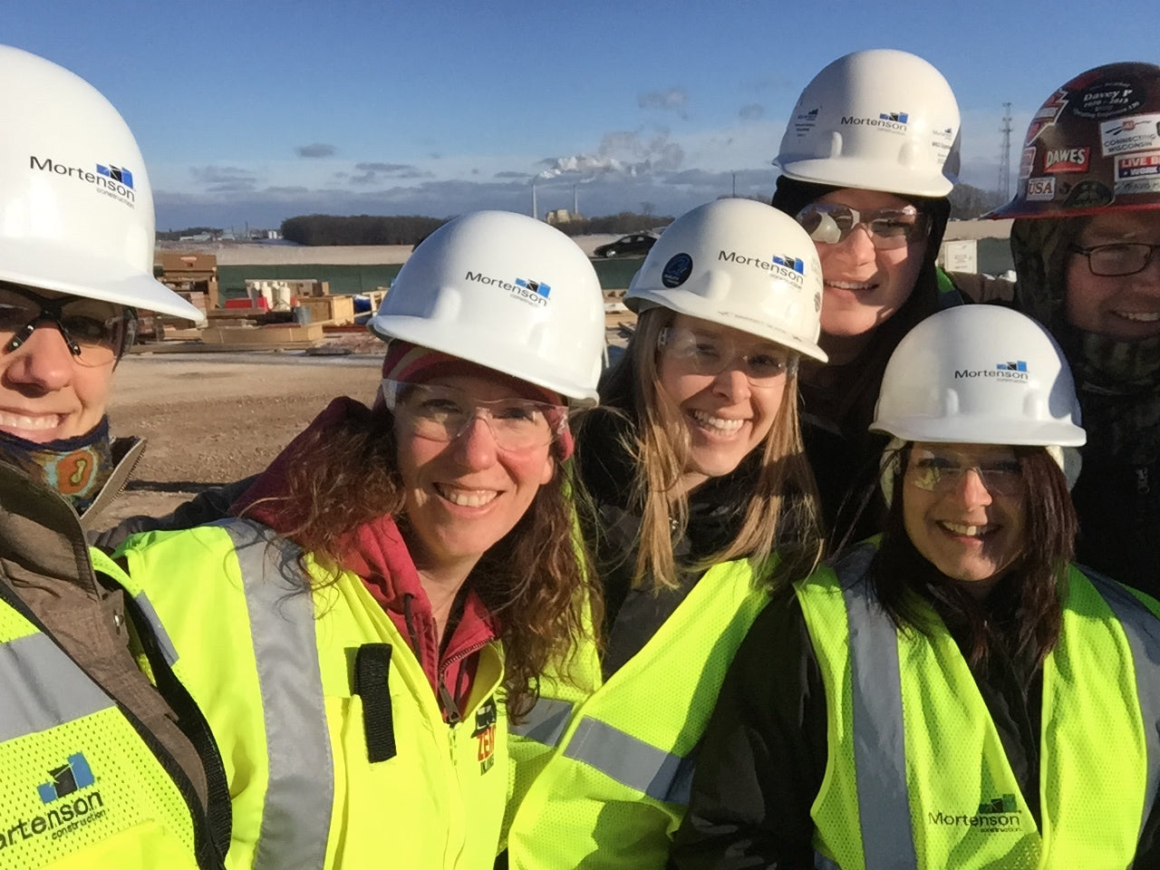 Robbie Oldenburg on a construction site with her team