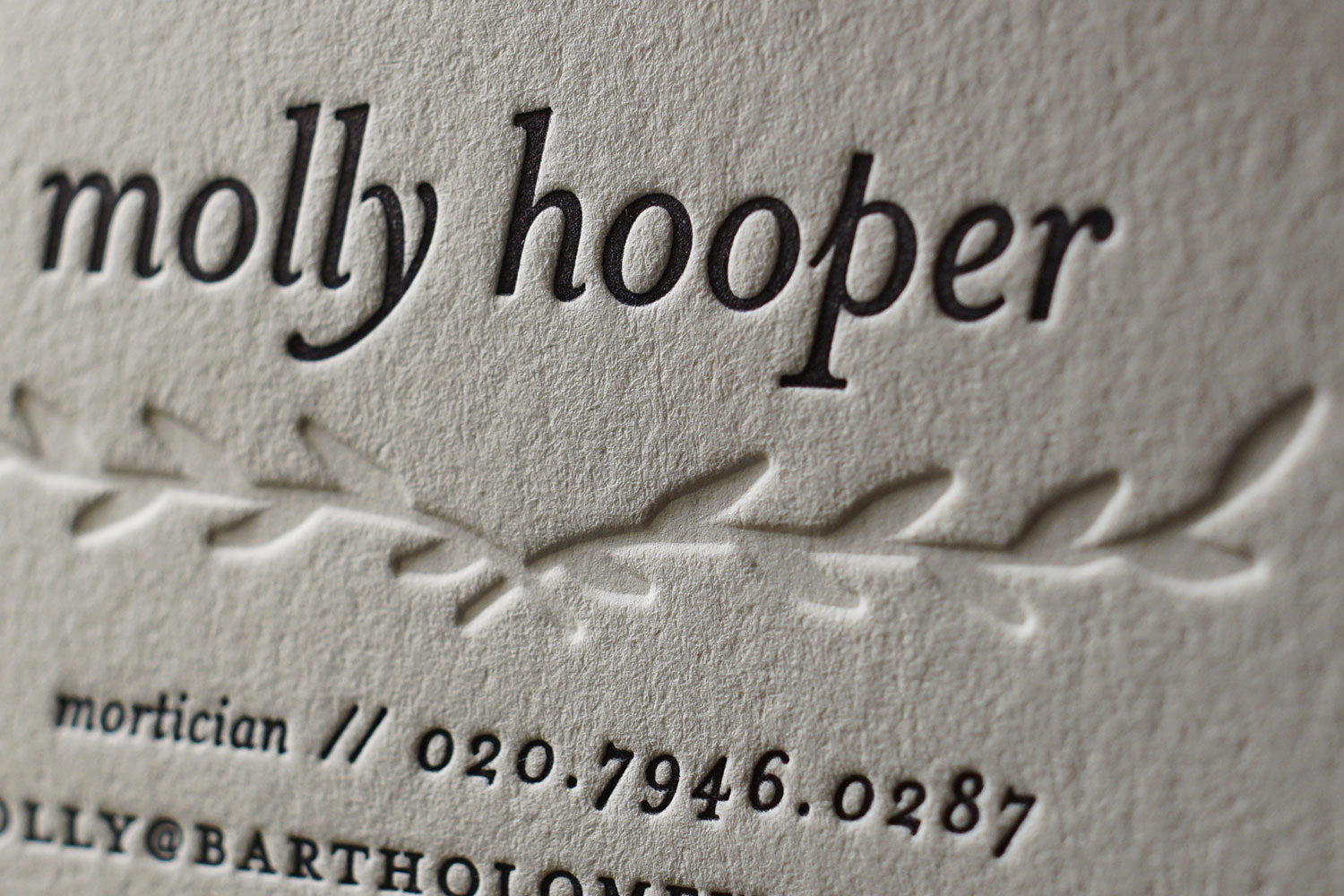 A close up example of a letterpress printed calling card