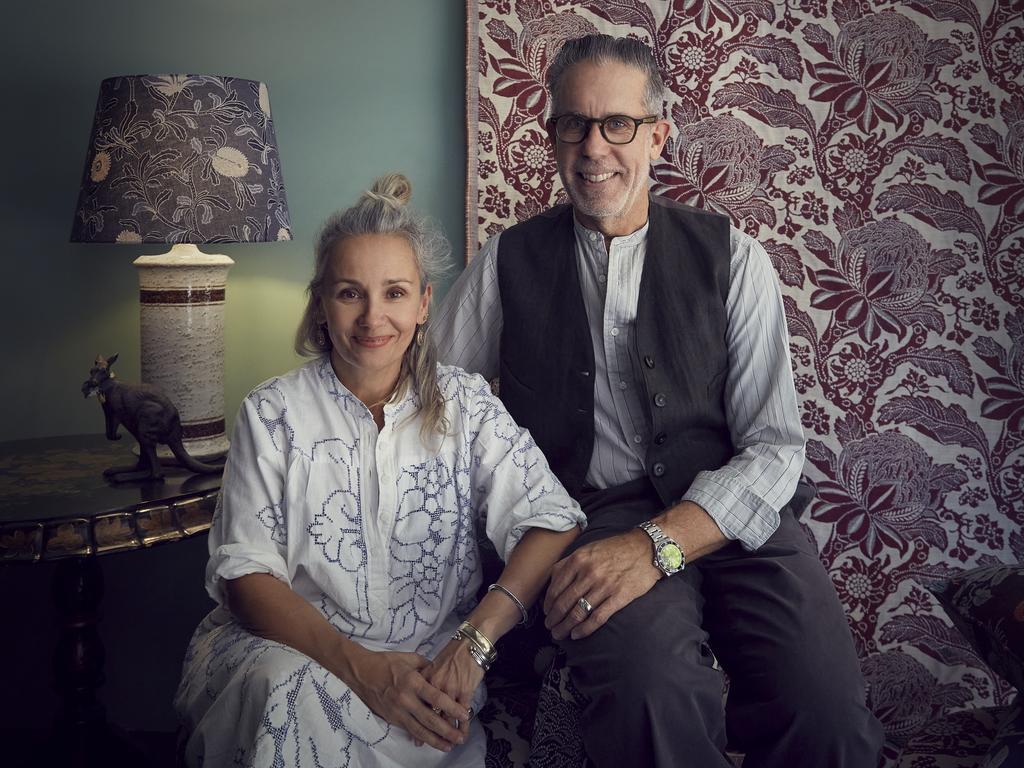 Portrait of Sophie Tatlow and Bruce Slorach sitting in front of Waratah Ruby Performance Fabric