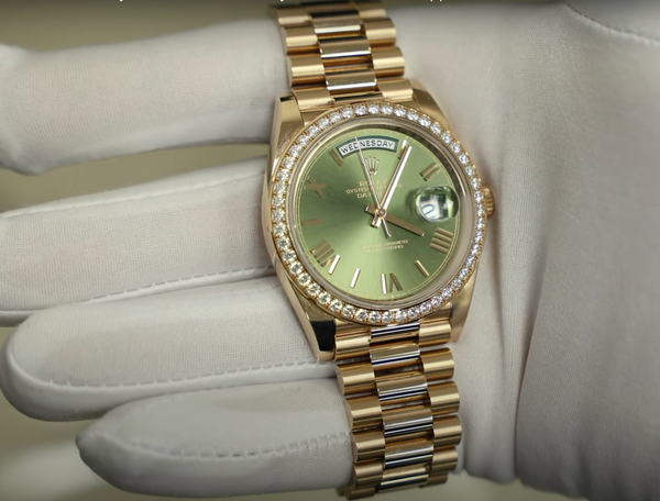 Rolex DayDate 40 228349rbr shown on hand - Rose Gold with Green Dial and Diamond Bezel
