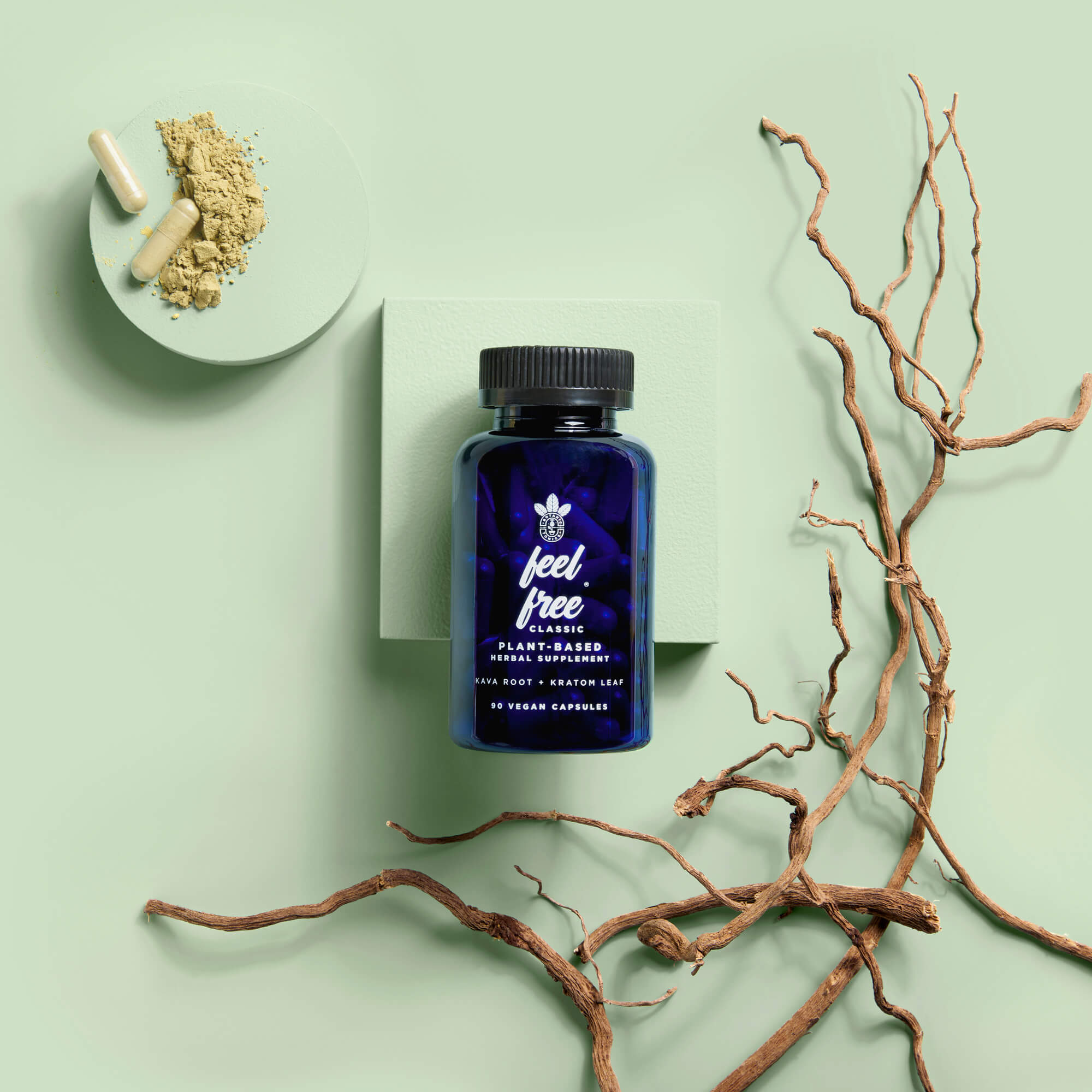 feel free classic wellness capsules - bottle with some twigs