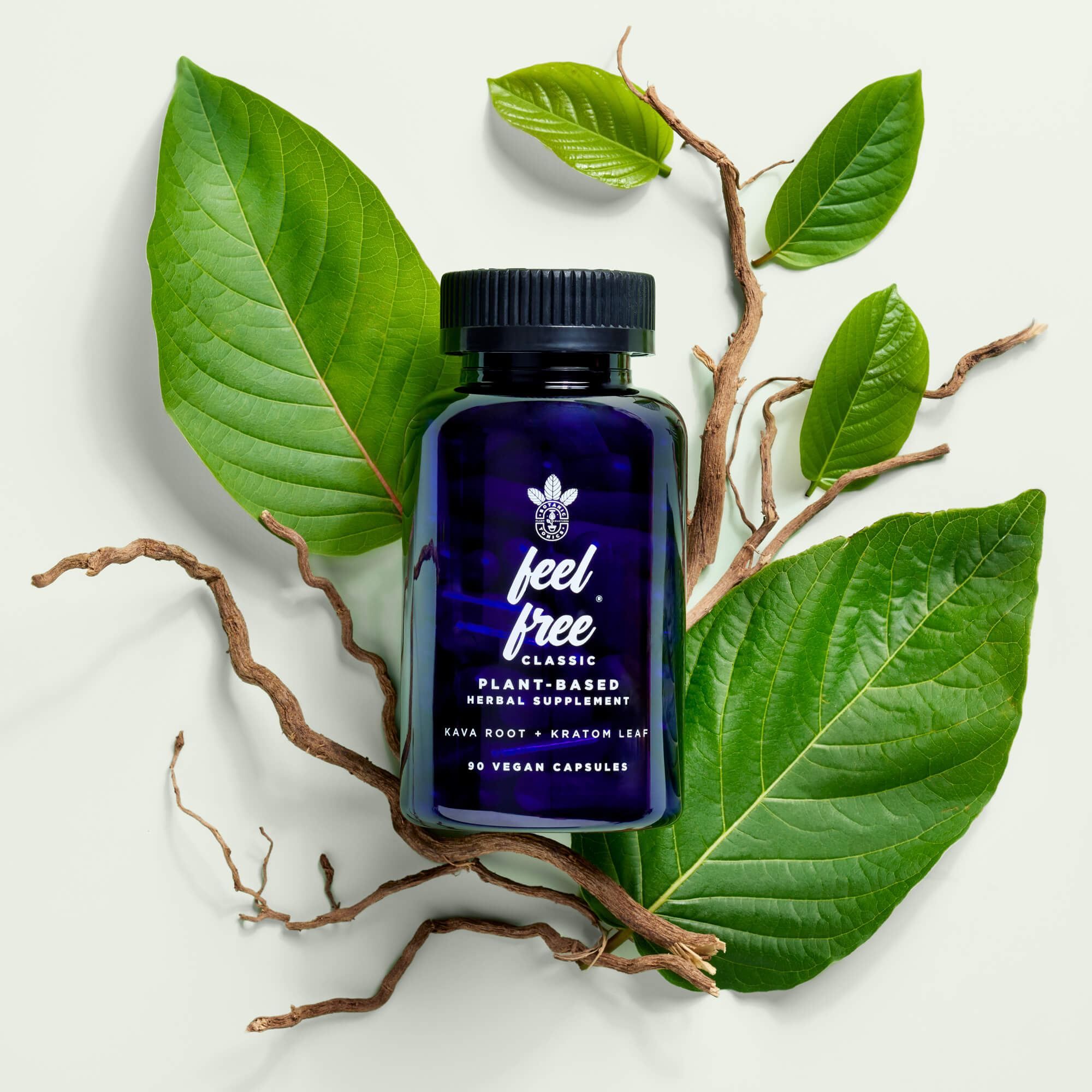 feel free classic wellness capsules - bottle on leaves