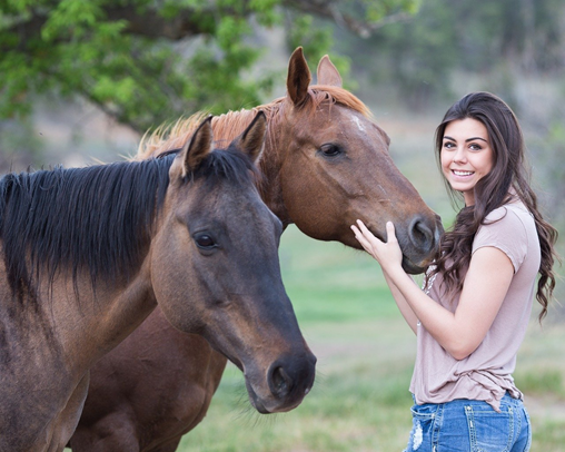 Two Horses and happy young Girl outdoor