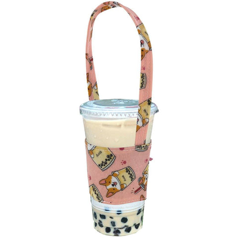 pink corgi drink holder from Tworgis holding a boba tea