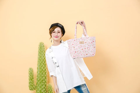 model holding a Tworgis tote bag