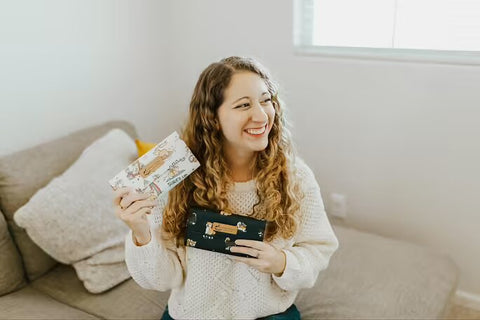 Girl Holding Tworgis Wallets