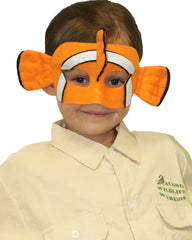 Orange Velociraptor mascot costume character dressed with a Capri