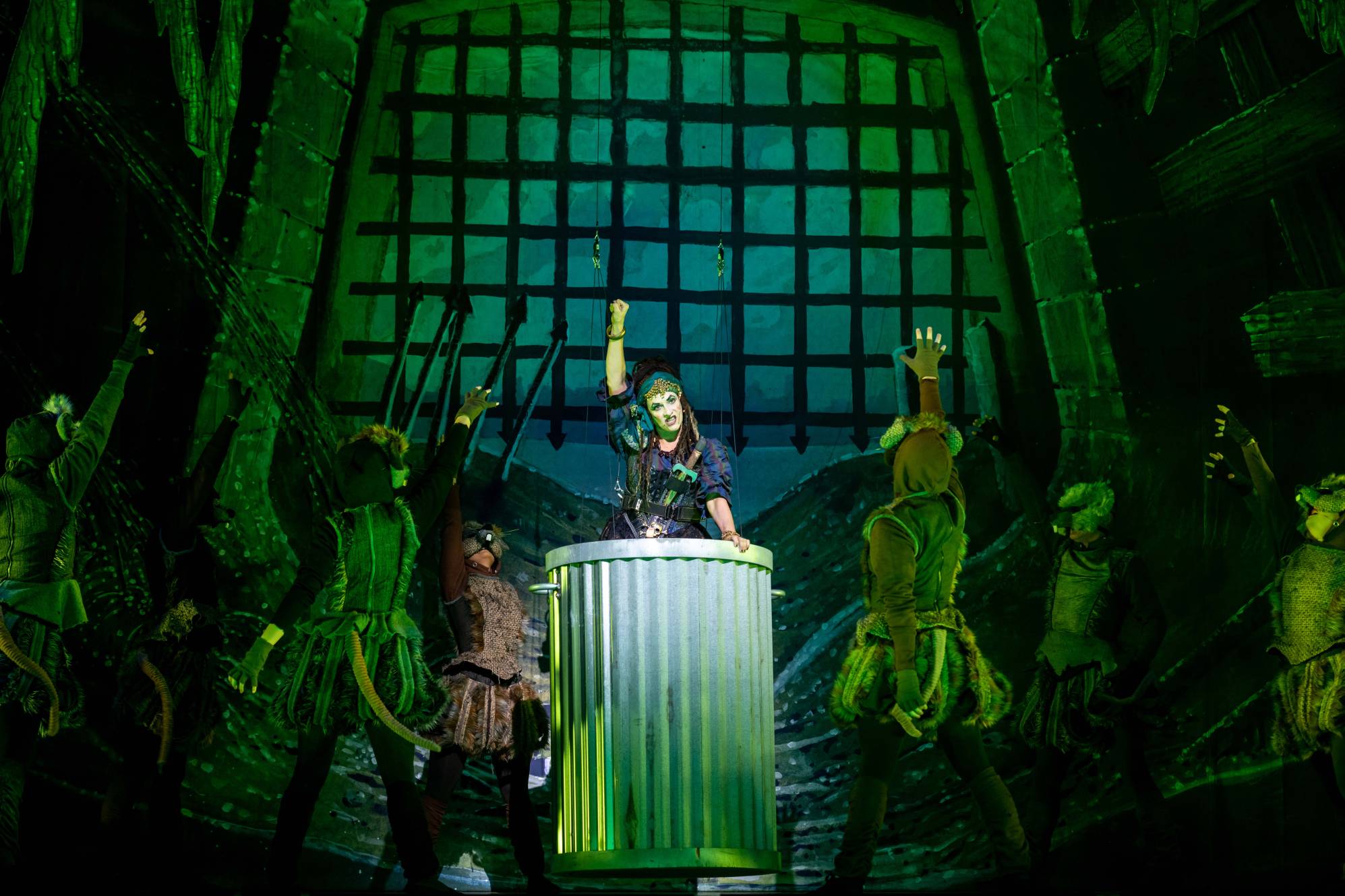 stage shot from Dick Whittington, several theatrical rats dance around a stage