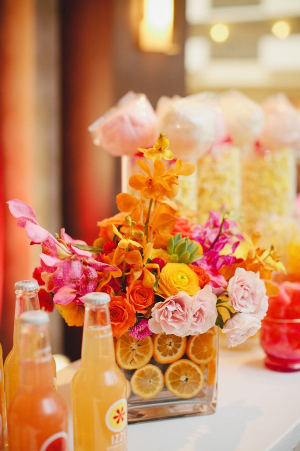 Pink and Orange Floral Arrangement with Cut Oranges | Kristyn Hogan via Studio Wed