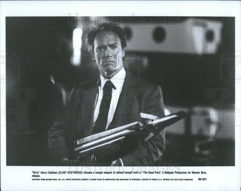 1988 Press Photo The Dead Pool Film Clint Eastwood Carrying Big Weapon Scene - Historic Images