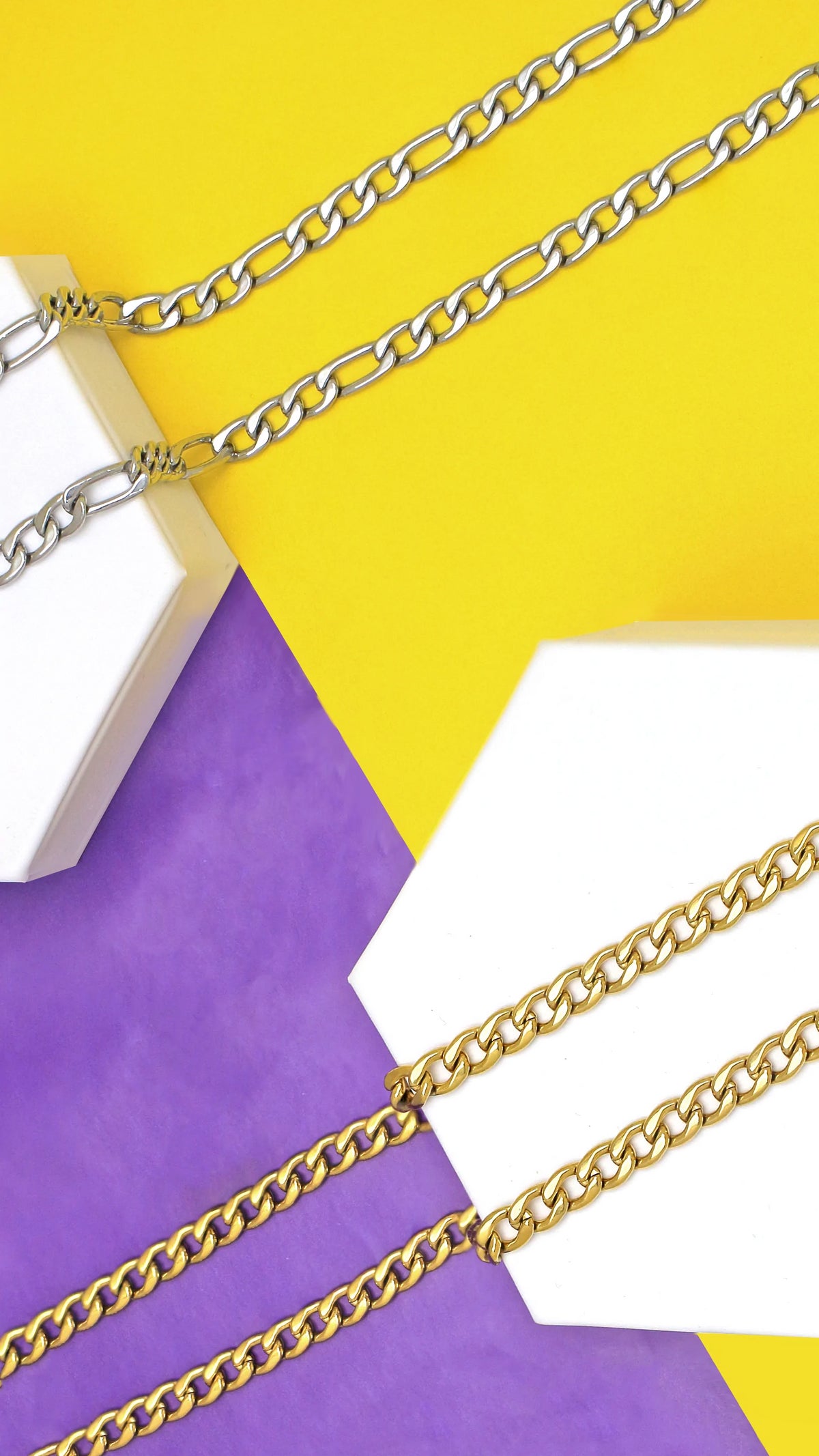 Yellow Gold Curb Chain and White Gold Figaro Chain on Purple and Yellow Background