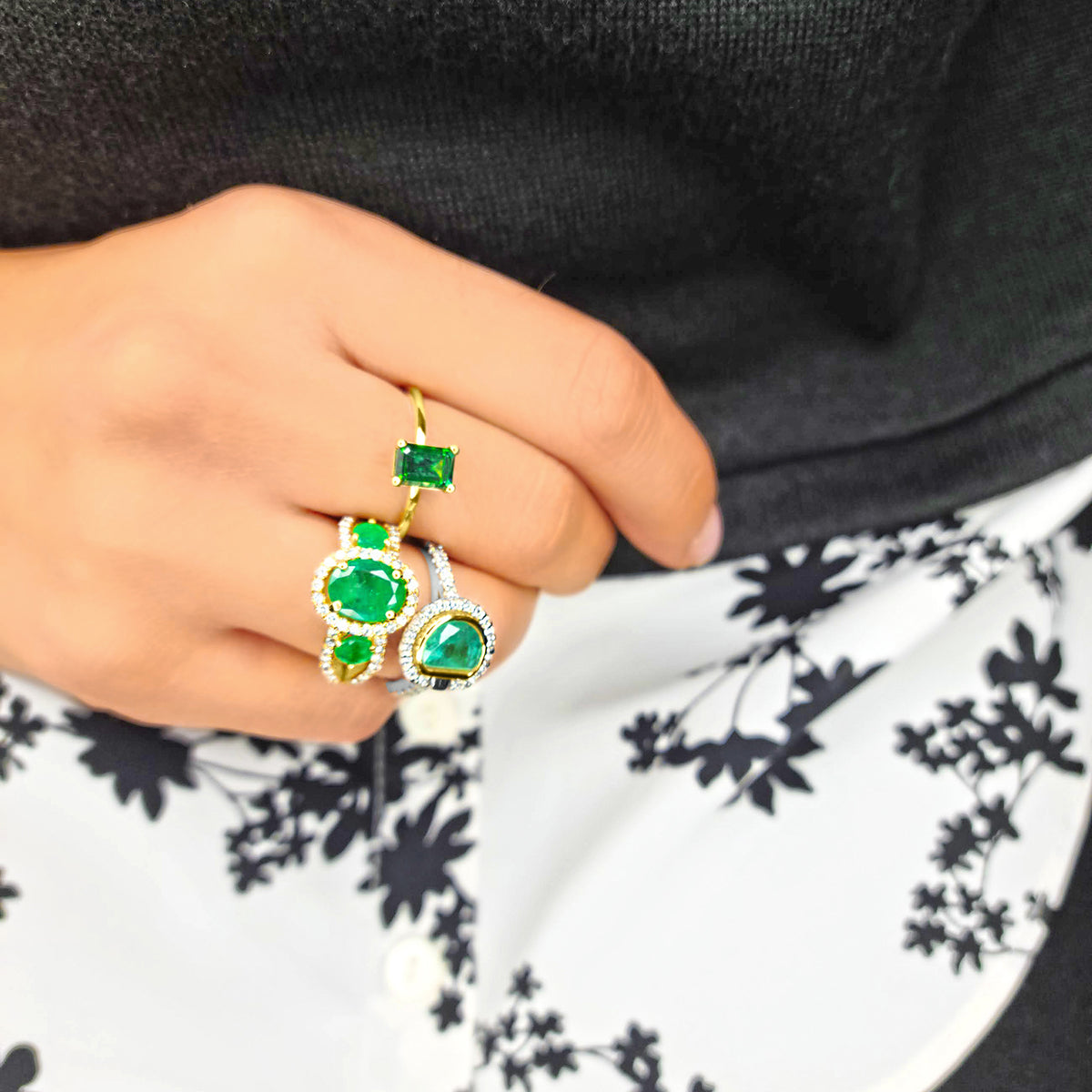 Gold Emerald Rings Worn by Woman