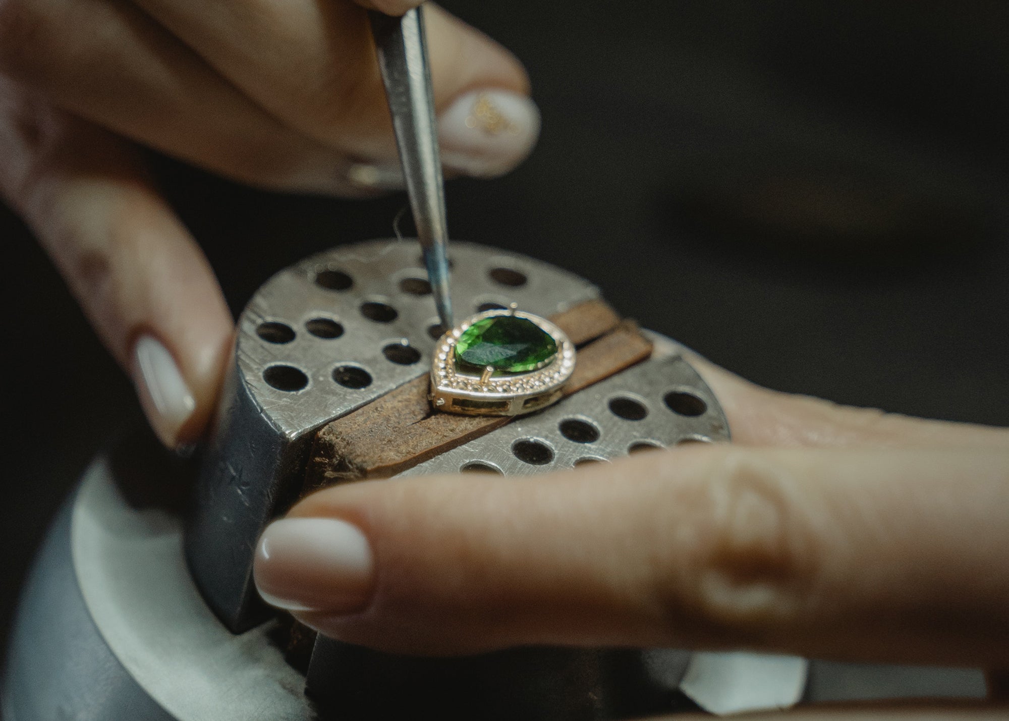 Pear Shaped Emerald being Set using Tools