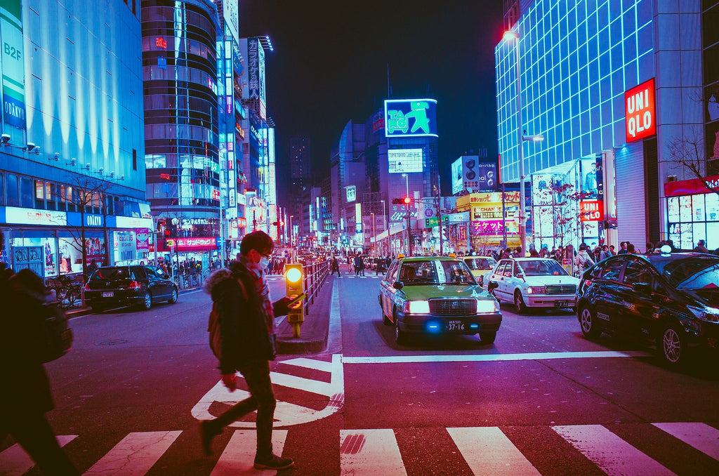 a photo of a night time tokyo street