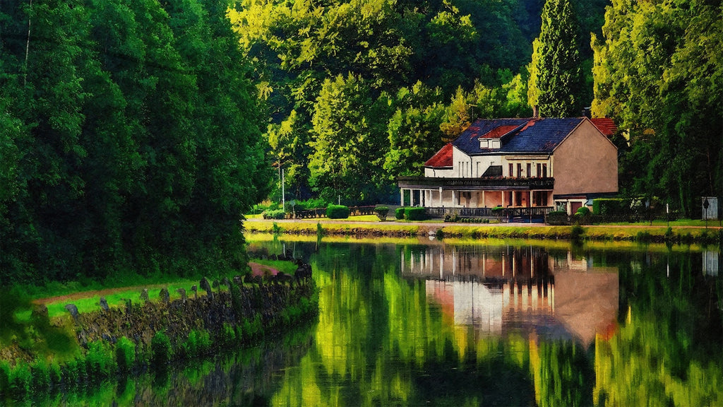 an outdoor photo of a barn and lake