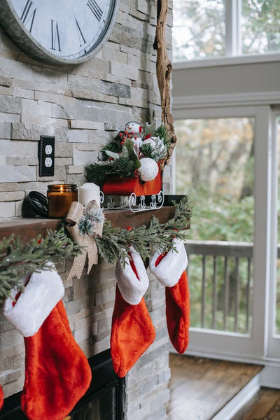 Christmas mantel detail with velvet stockings
