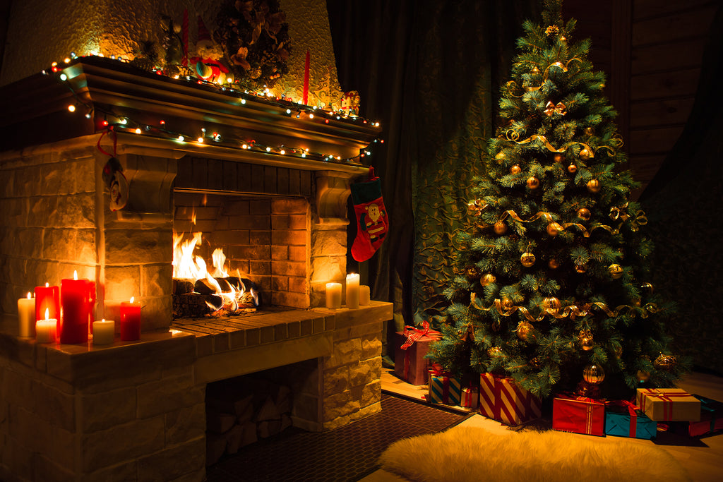Christmas Tree and Lighted Mantel with Fire in the Fireplace
