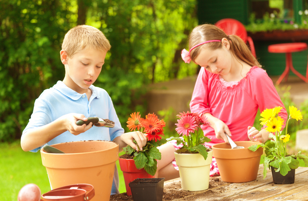 Children planting seeds in a garden