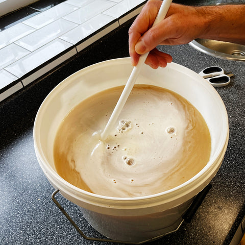 Gently stir to dissolve the priming sugar