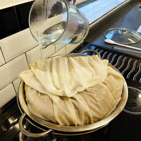 Rinsing the Grains with a pint of boiling water