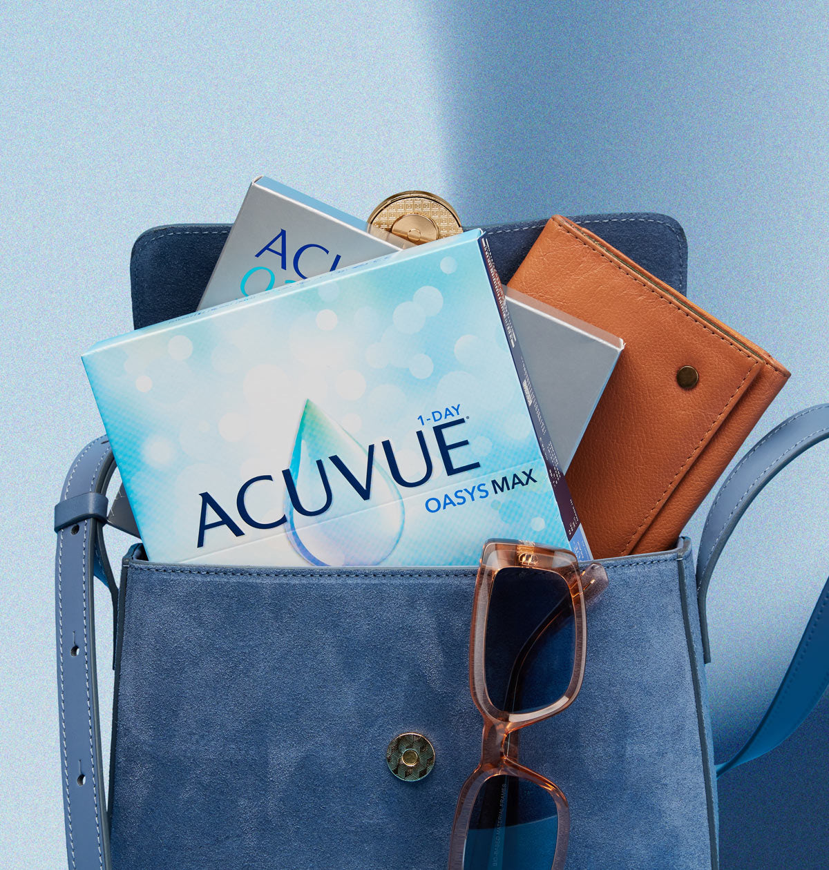 Blue bag with Acuvue contact lens boxes, glasses, and wallet.