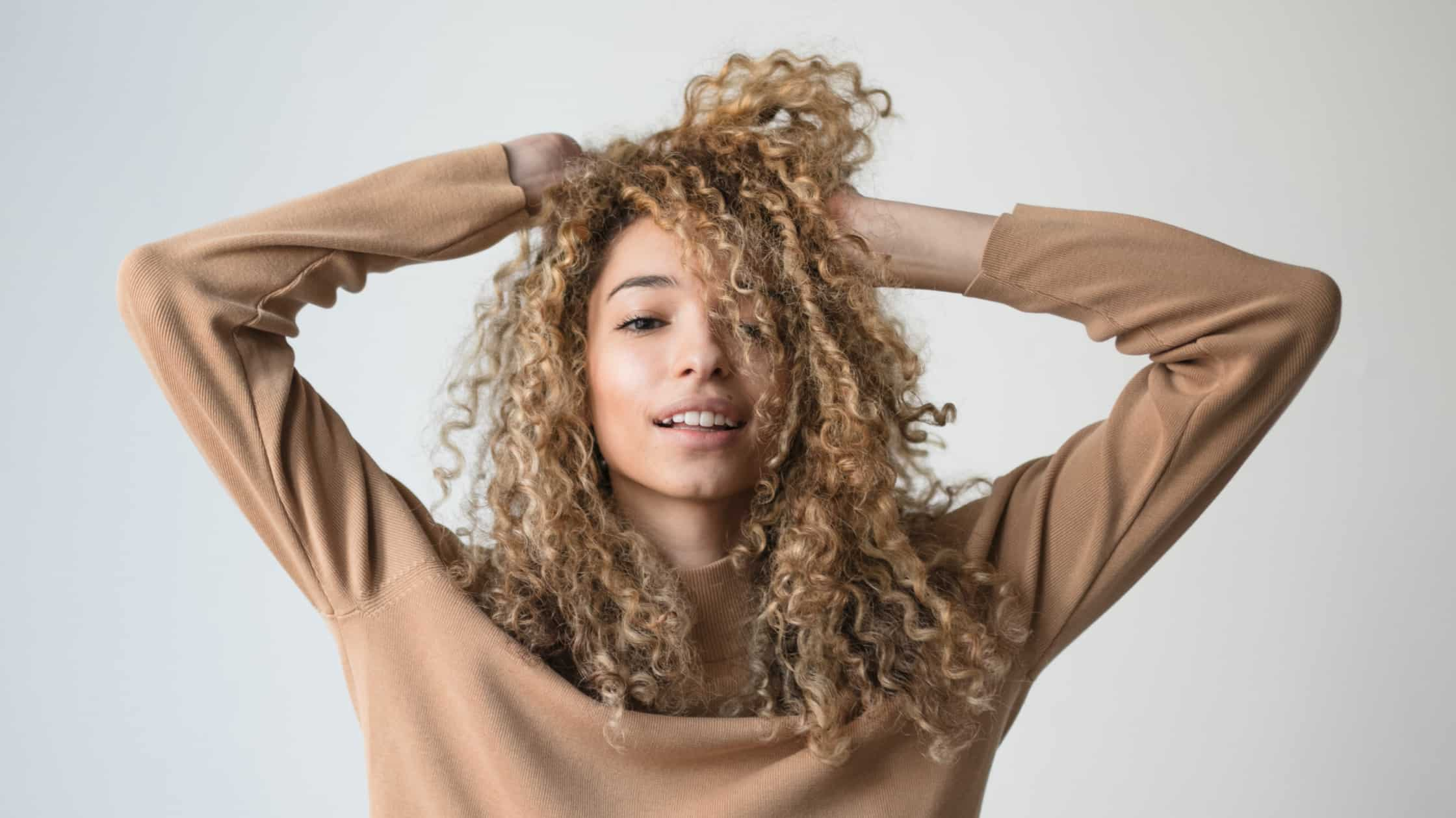 Flexing her beautiful curly hair